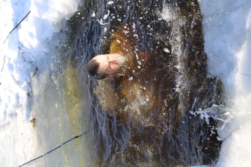 Cold-Weather Operations Course Class 18-04 students complete cold-water immersion training at Fort McCoy