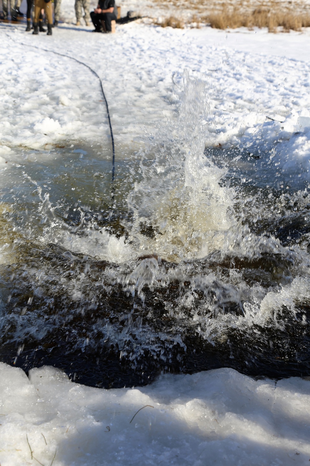 Cold-Weather Operations Course Class 18-04 students complete cold-water immersion training at Fort McCoy