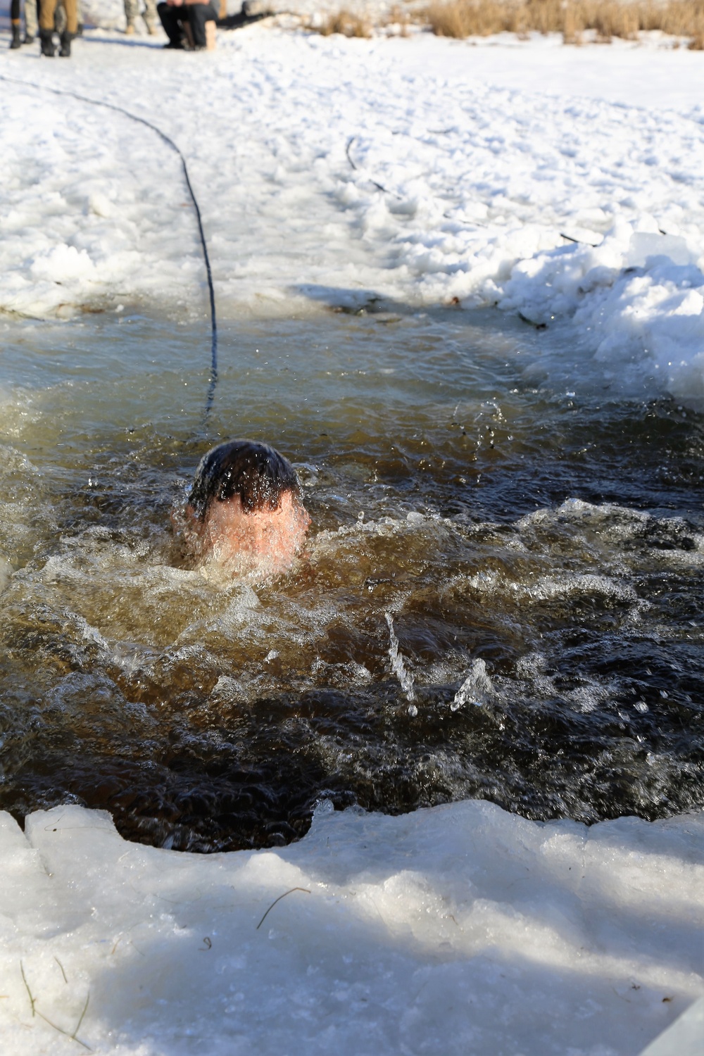 Cold-Weather Operations Course Class 18-04 students complete cold-water immersion training at Fort McCoy