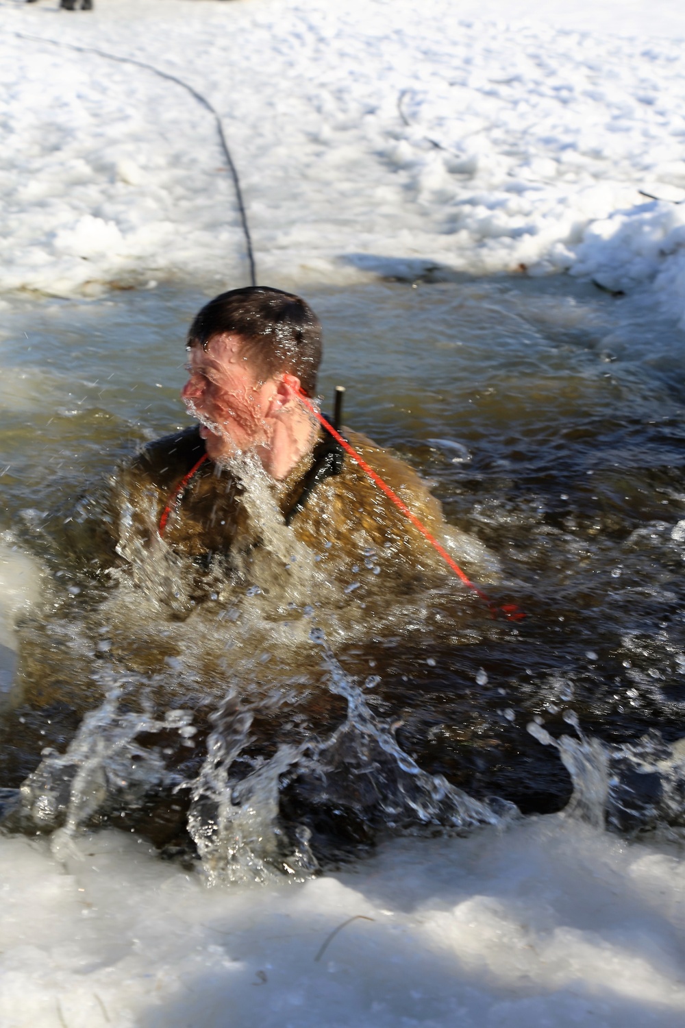 Cold-Weather Operations Course Class 18-04 students complete cold-water immersion training at Fort McCoy