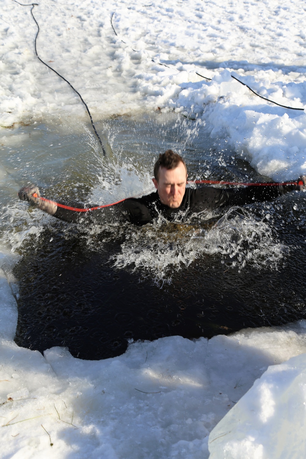 Cold-Weather Operations Course Class 18-04 students complete cold-water immersion training at Fort McCoy