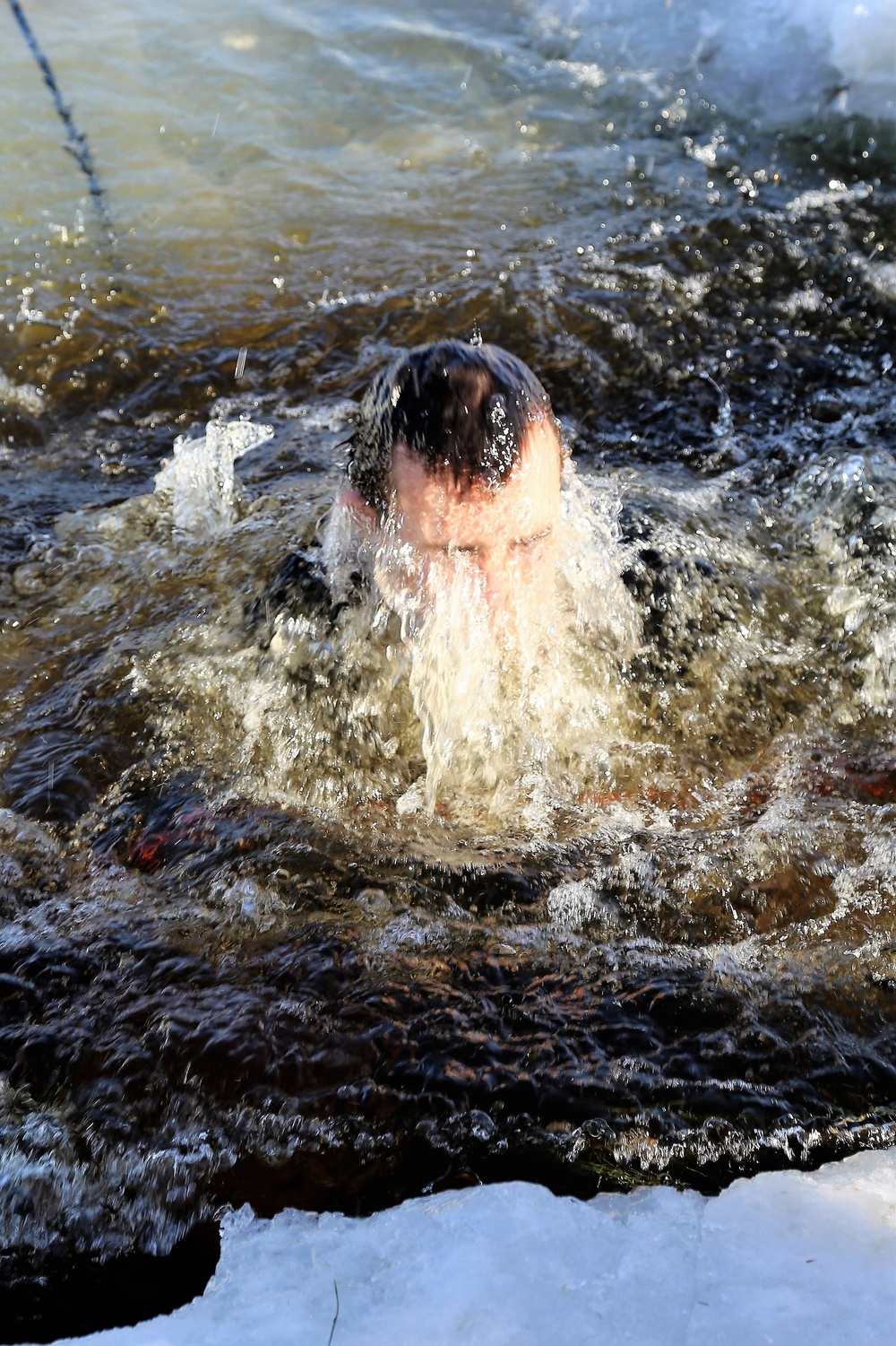 Cold-Weather Operations Course Class 18-04 students complete cold-water immersion training at Fort McCoy