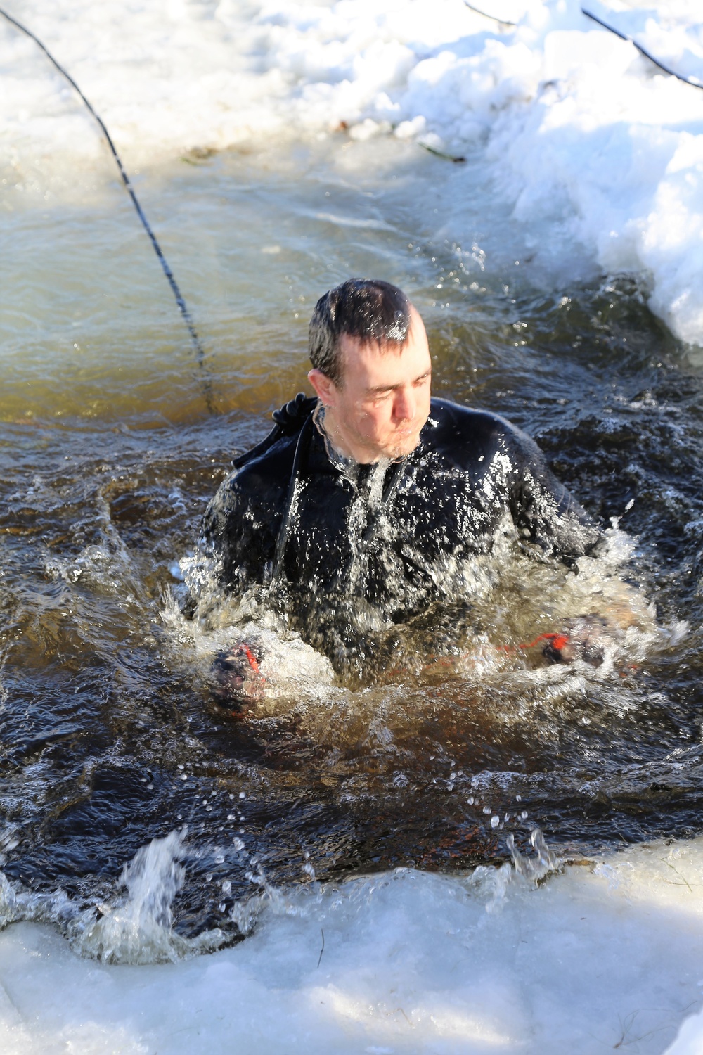 Cold-Weather Operations Course Class 18-04 students complete cold-water immersion training at Fort McCoy