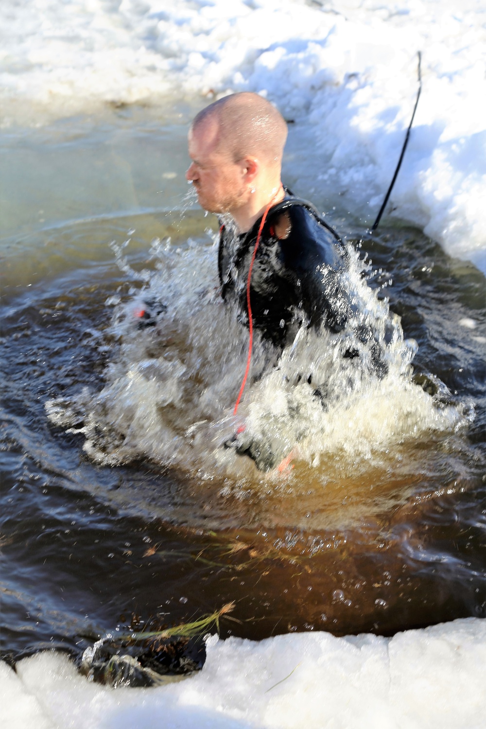 Cold-Weather Operations Course Class 18-04 students complete cold-water immersion training at Fort McCoy