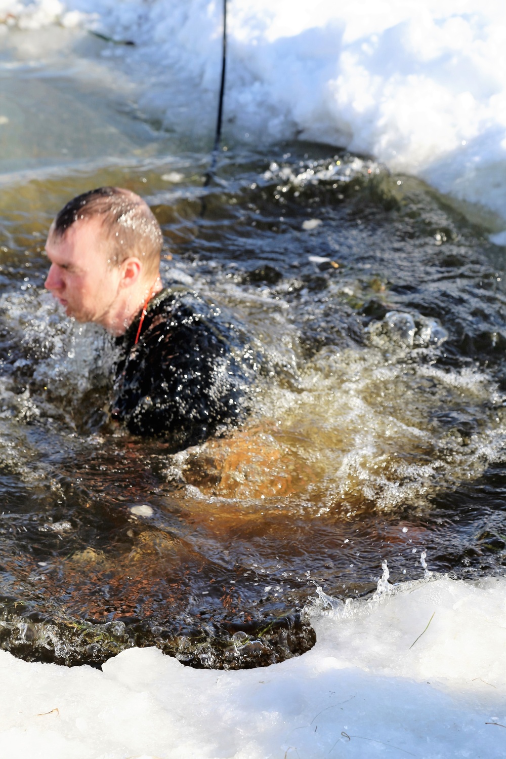 Cold-Weather Operations Course Class 18-04 students complete cold-water immersion training at Fort McCoy