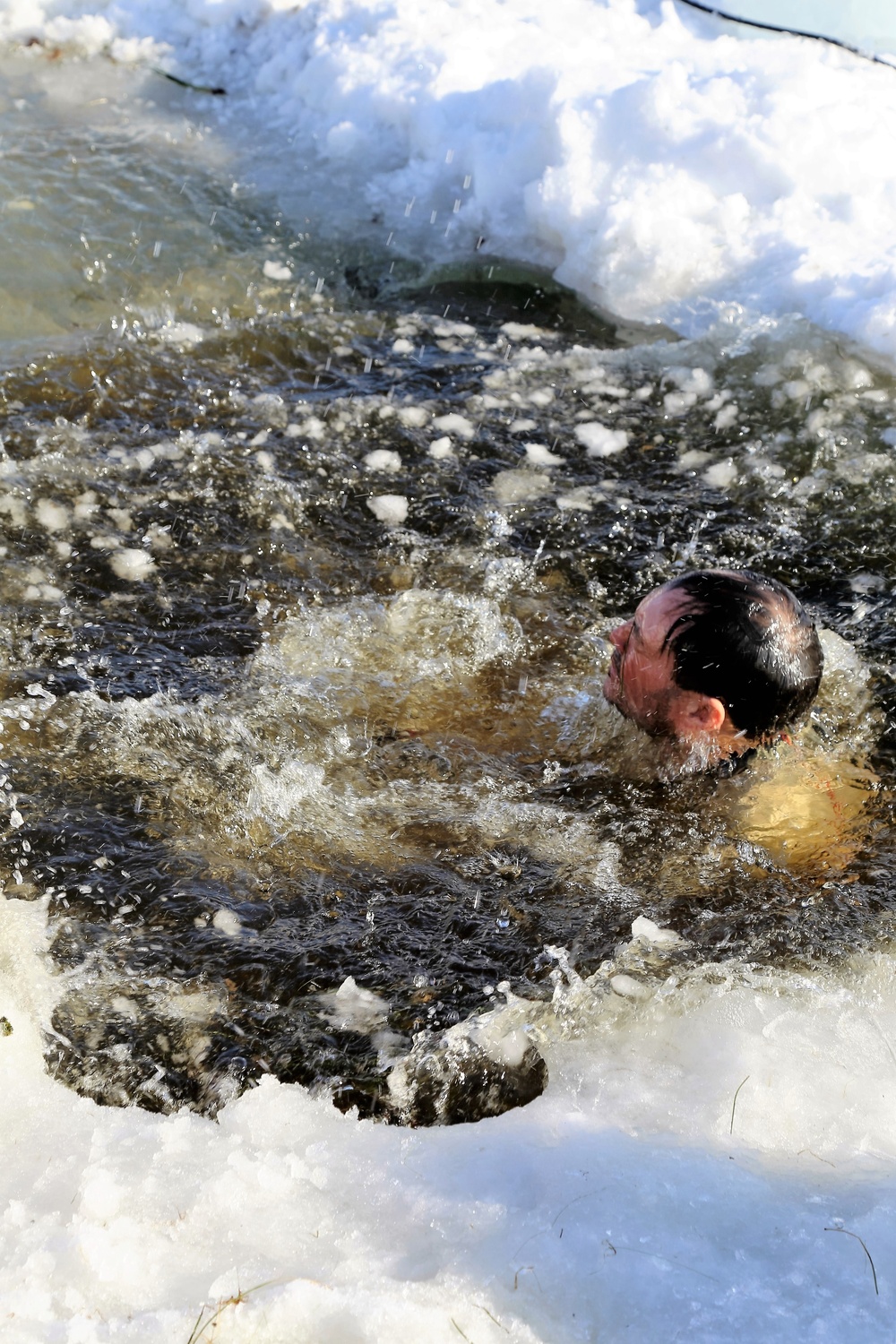 Cold-Weather Operations Course Class 18-04 students complete cold-water immersion training at Fort McCoy