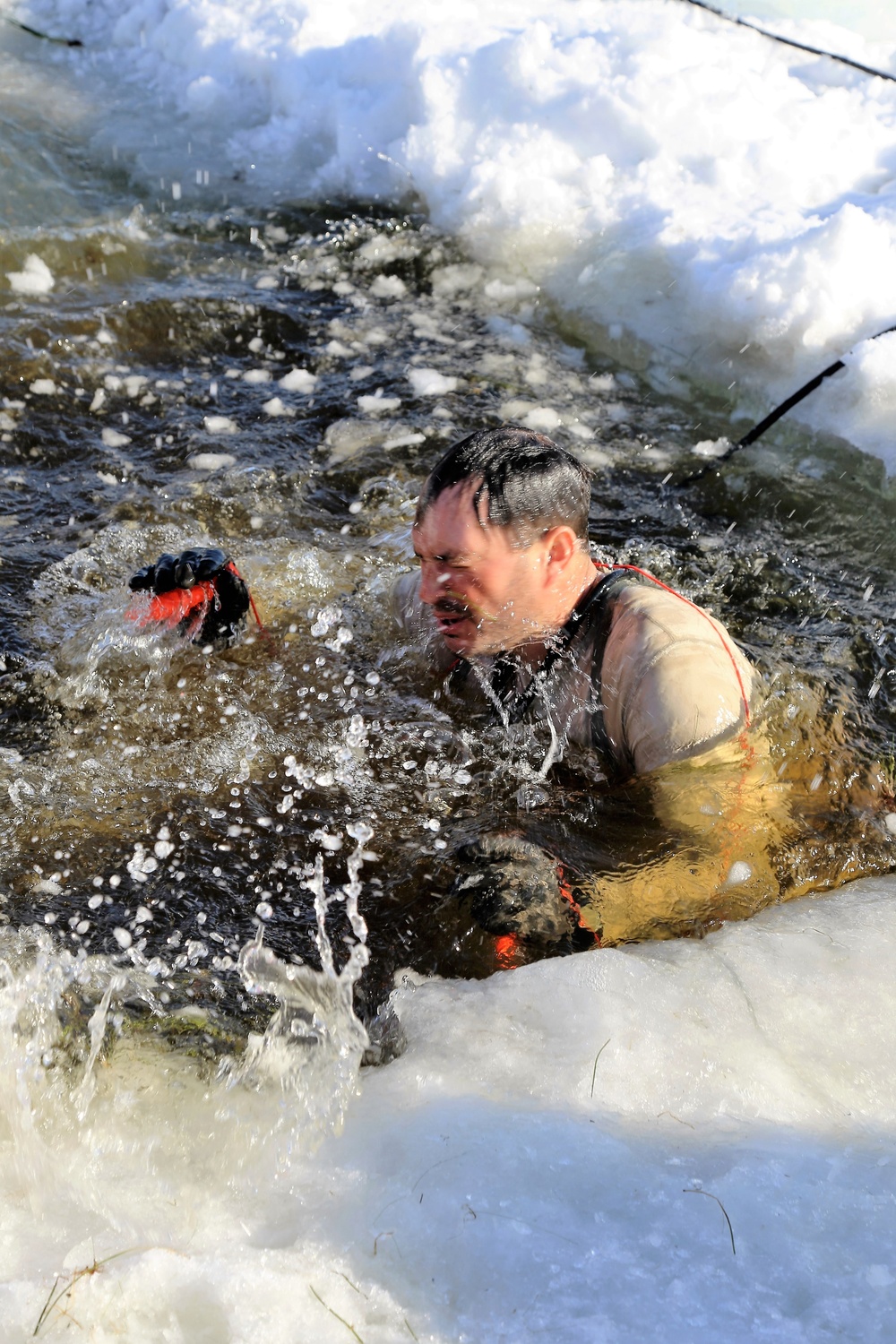 Cold-Weather Operations Course Class 18-04 students complete cold-water immersion training at Fort McCoy