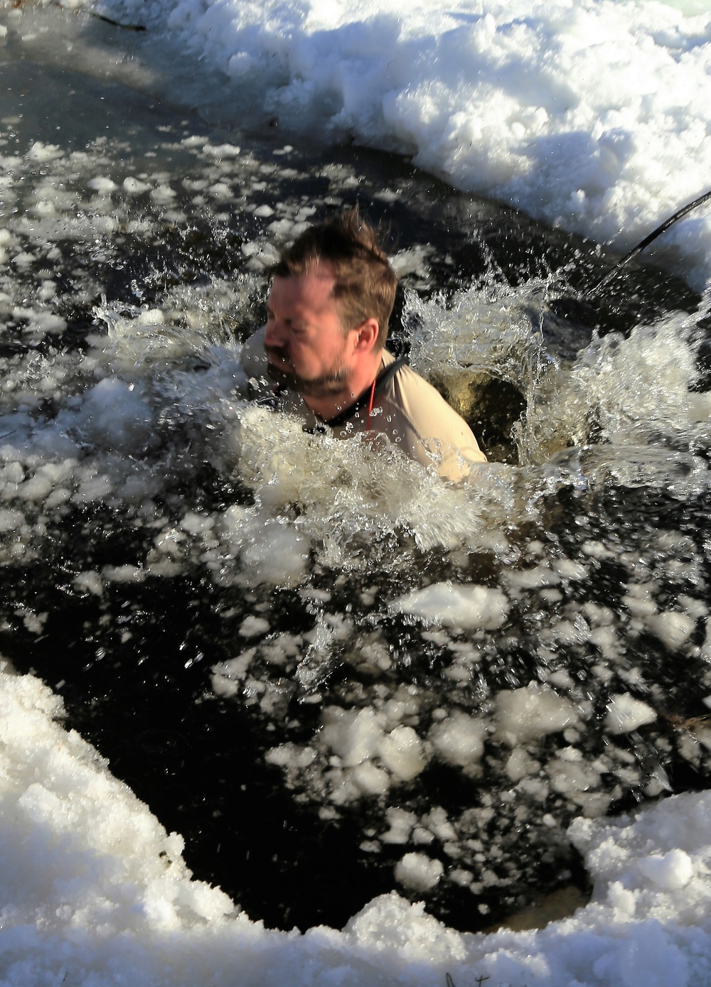 Cold-Weather Operations Course Class 18-04 students complete cold-water immersion training at Fort McCoy