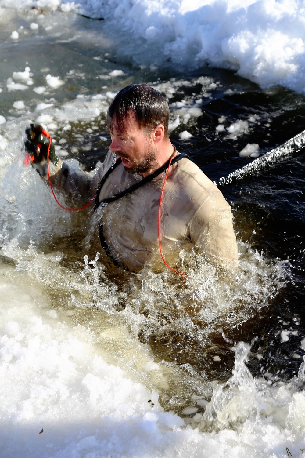 Cold-Weather Operations Course Class 18-04 students complete cold-water immersion training at Fort McCoy