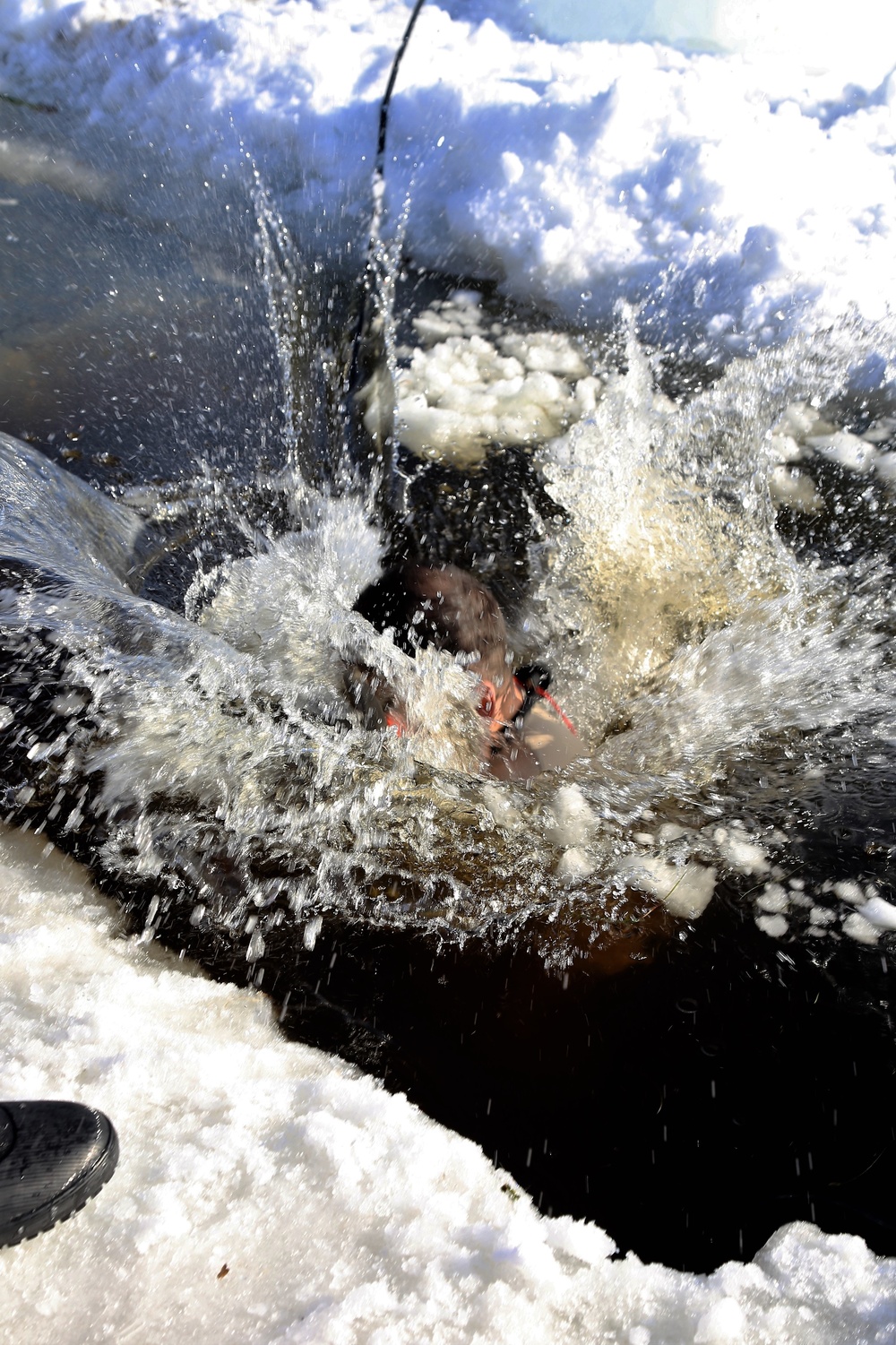 Cold-Weather Operations Course Class 18-04 students complete cold-water immersion training at Fort McCoy