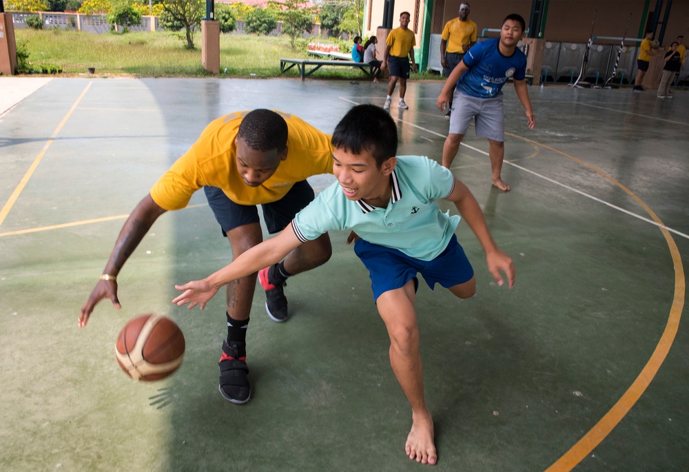 USS Bonhomme Richard (LHD 6) Sailors visit the Child Protection and Development Center as part of COMREL