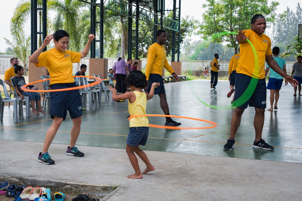 USS Bonhomme Richard (LHD 6) Sailors visit the Child Protection and Development Center as part of COMREL