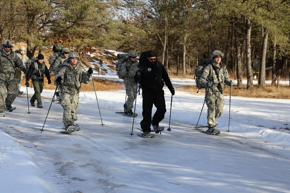 Cold-Weather Operations Course Class 18-05 students practice snowshoeing at Fort McCoy