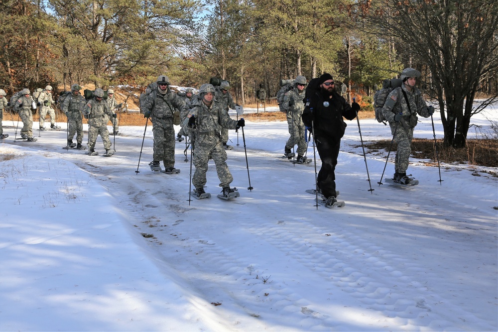 Cold-Weather Operations Course Class 18-05 students practice snowshoeing at Fort McCoy