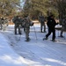 Cold-Weather Operations Course Class 18-05 students practice snowshoeing at Fort McCoy