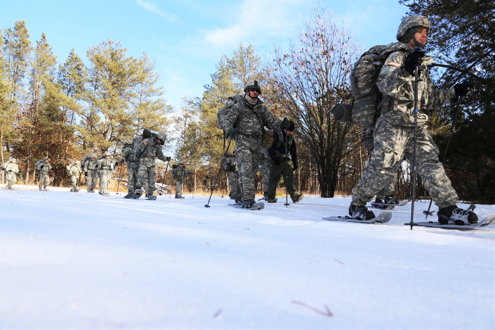 Cold-Weather Operations Course Class 18-05 students practice snowshoeing at Fort McCoy