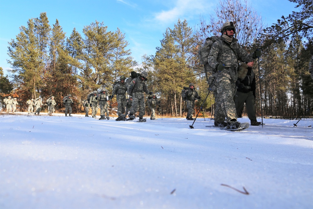 Cold-Weather Operations Course Class 18-05 students practice snowshoeing at Fort McCoy