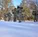 Cold-Weather Operations Course Class 18-05 students practice snowshoeing at Fort McCoy