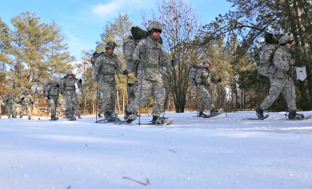 Cold-Weather Operations Course Class 18-05 students practice snowshoeing at Fort McCoy