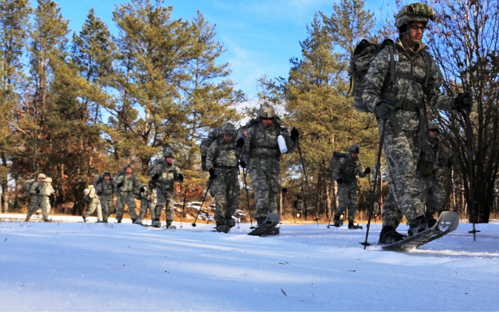 Cold-Weather Operations Course Class 18-05 students practice snowshoeing at Fort McCoy