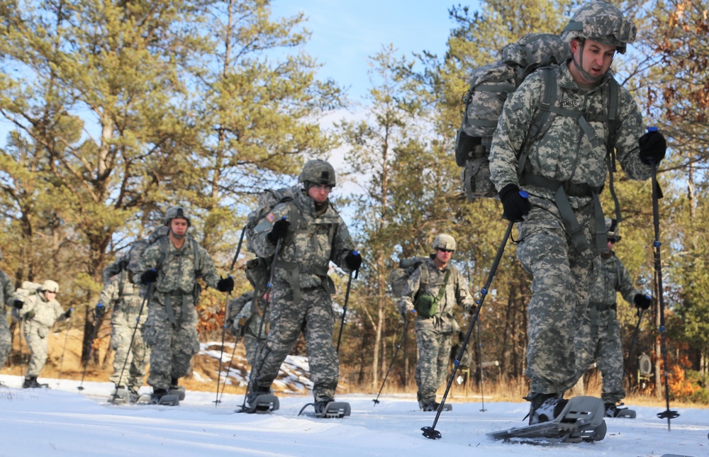 Cold-Weather Operations Course Class 18-05 students practice snowshoeing at Fort McCoy