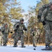 Cold-Weather Operations Course Class 18-05 students practice snowshoeing at Fort McCoy