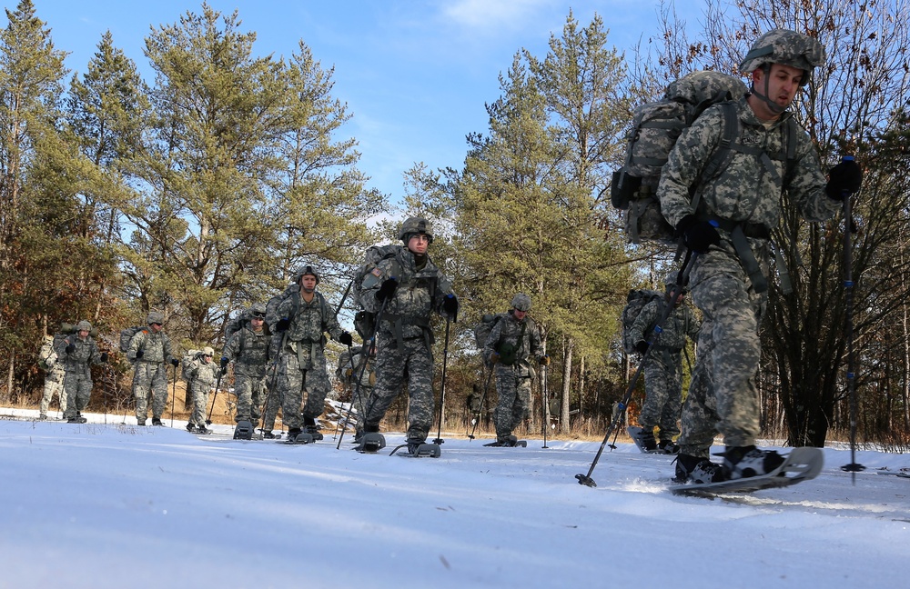 Cold-Weather Operations Course Class 18-05 students practice snowshoeing at Fort McCoy