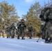 Cold-Weather Operations Course Class 18-05 students practice snowshoeing at Fort McCoy