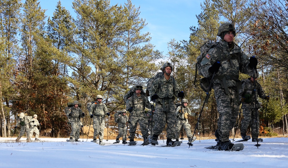 Cold-Weather Operations Course Class 18-05 students practice snowshoeing at Fort McCoy