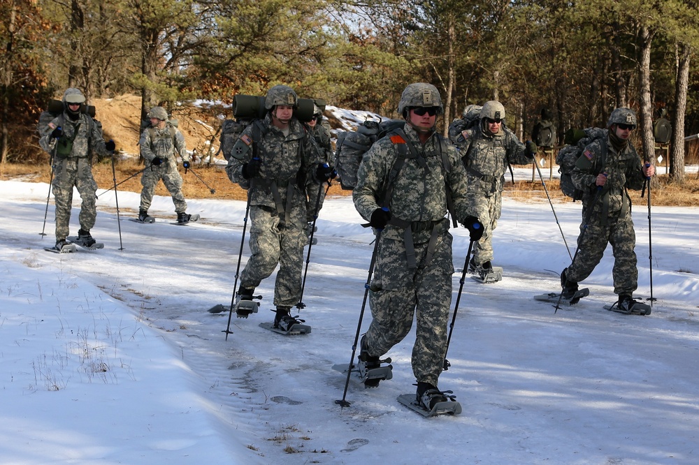 Cold-Weather Operations Course Class 18-05 students practice snowshoeing at Fort McCoy