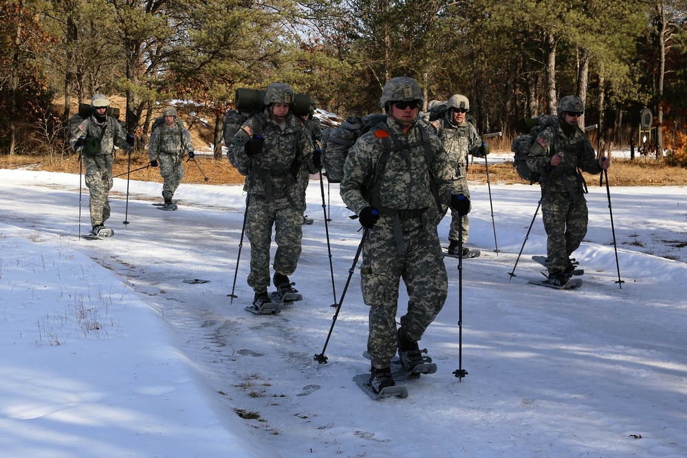 Cold-Weather Operations Course Class 18-05 students practice snowshoeing at Fort McCoy