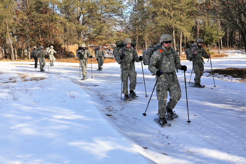 Cold-Weather Operations Course Class 18-05 students practice snowshoeing at Fort McCoy