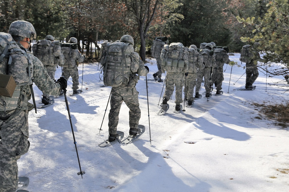 Cold-Weather Operations Course Class 18-05 students practice snowshoeing at Fort McCoy