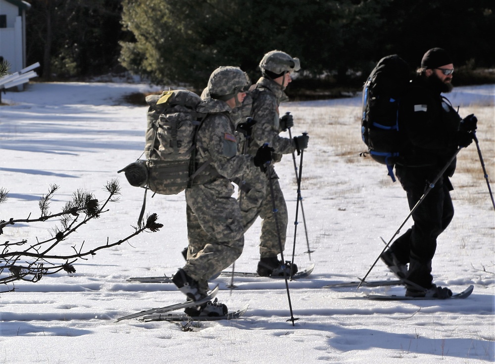 Cold-Weather Operations Course Class 18-05 students practice snowshoeing at Fort McCoy