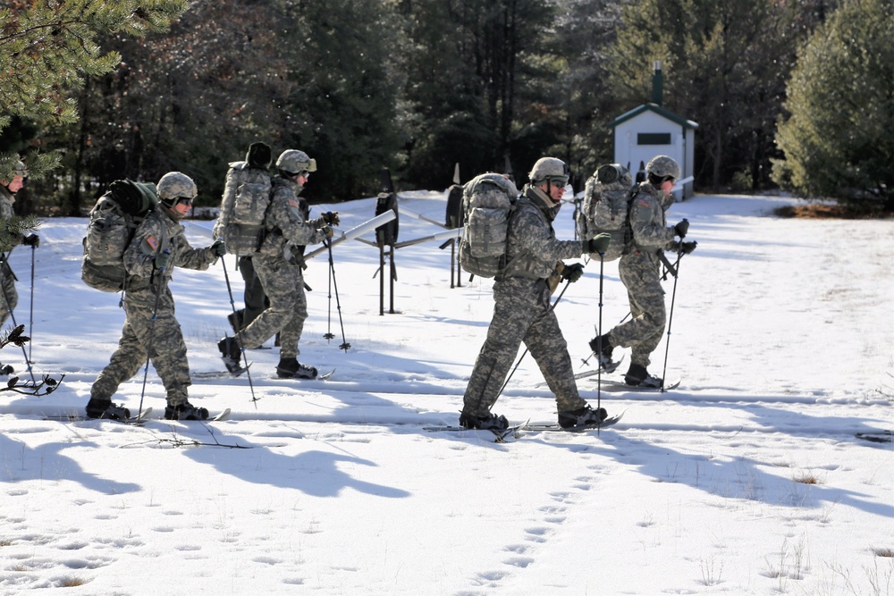 Cold-Weather Operations Course Class 18-05 students practice snowshoeing at Fort McCoy