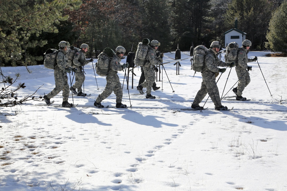 Cold-Weather Operations Course Class 18-05 students practice snowshoeing at Fort McCoy