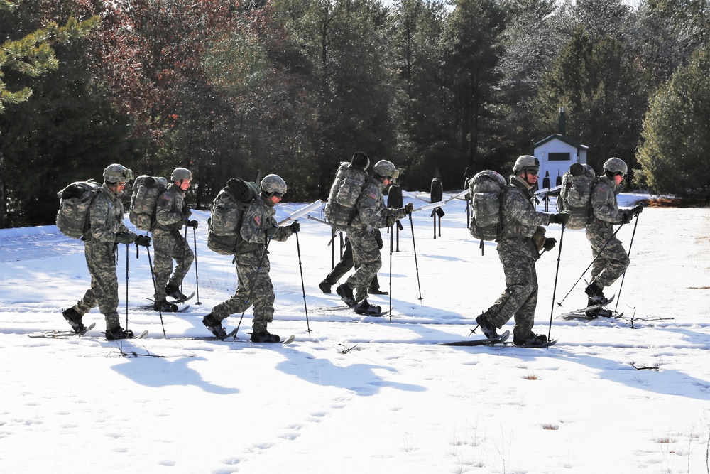 Cold-Weather Operations Course Class 18-05 students practice snowshoeing at Fort McCoy