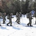 Cold-Weather Operations Course Class 18-05 students practice snowshoeing at Fort McCoy