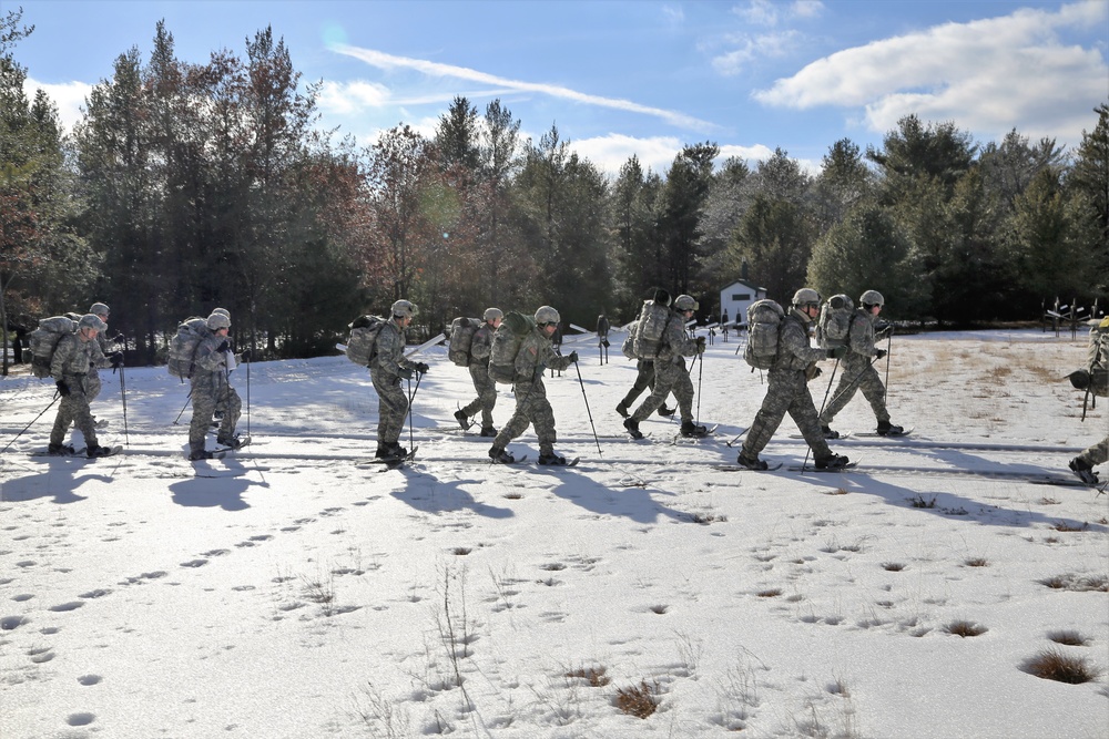 Cold-Weather Operations Course Class 18-05 students practice snowshoeing at Fort McCoy