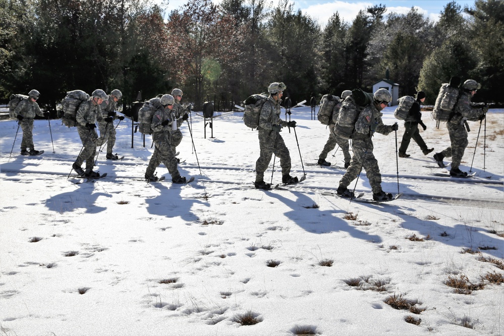 Cold-Weather Operations Course Class 18-05 students practice snowshoeing at Fort McCoy