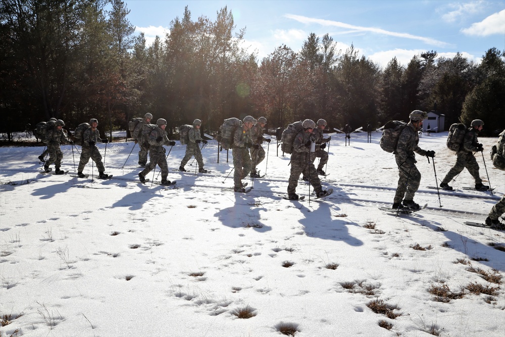 Cold-Weather Operations Course Class 18-05 students practice snowshoeing at Fort McCoy