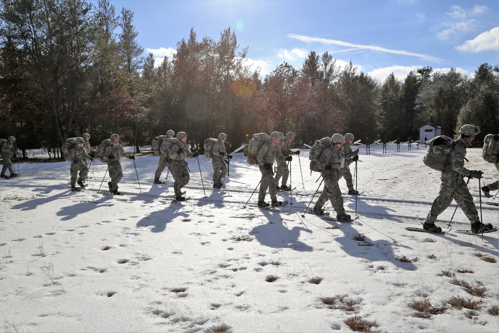 Cold-Weather Operations Course Class 18-05 students practice snowshoeing at Fort McCoy