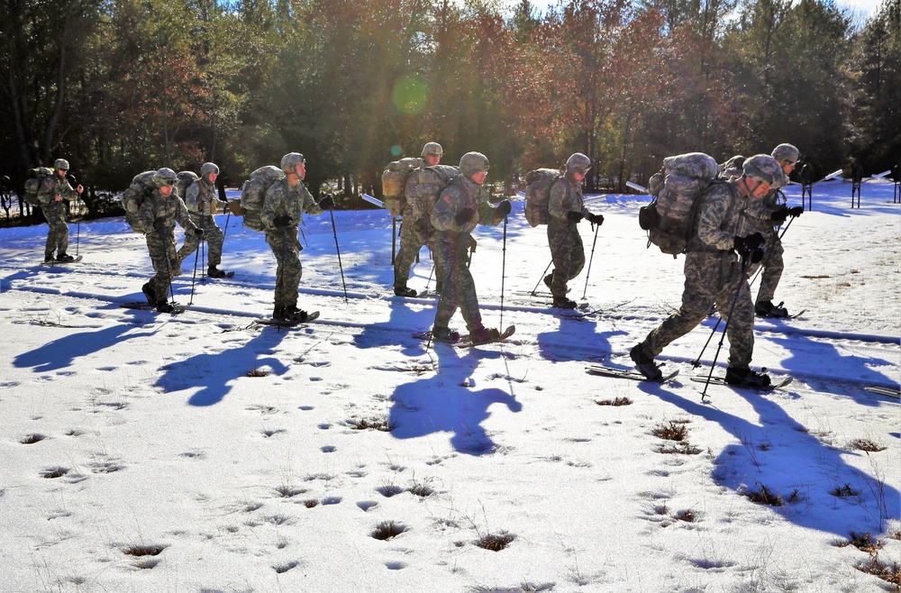 Cold-Weather Operations Course Class 18-05 students practice snowshoeing at Fort McCoy