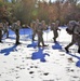 Cold-Weather Operations Course Class 18-05 students practice snowshoeing at Fort McCoy