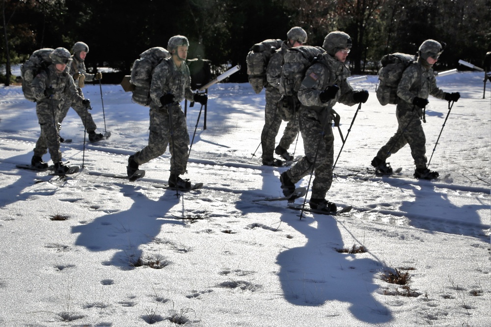 Cold-Weather Operations Course Class 18-05 students practice snowshoeing at Fort McCoy