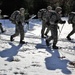 Cold-Weather Operations Course Class 18-05 students practice snowshoeing at Fort McCoy