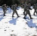 Cold-Weather Operations Course Class 18-05 students practice snowshoeing at Fort McCoy