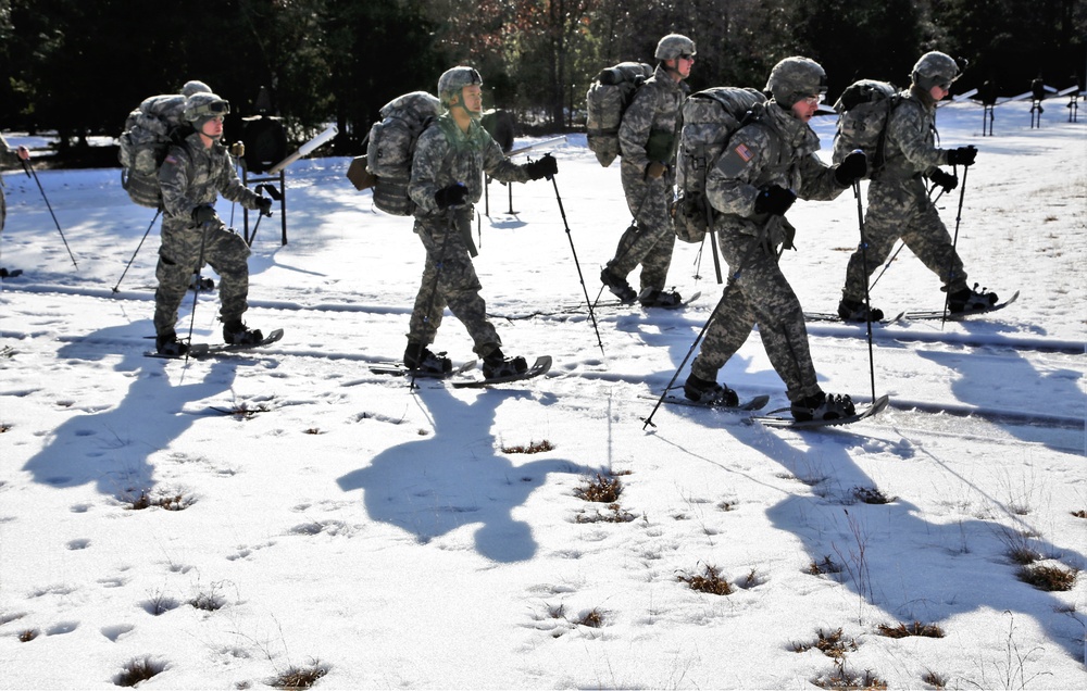 Cold-Weather Operations Course Class 18-05 students practice snowshoeing at Fort McCoy