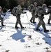 Cold-Weather Operations Course Class 18-05 students practice snowshoeing at Fort McCoy