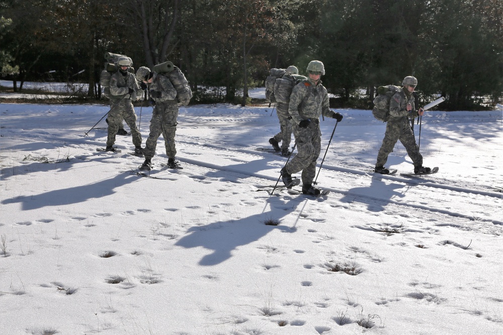 Cold-Weather Operations Course Class 18-05 students practice snowshoeing at Fort McCoy